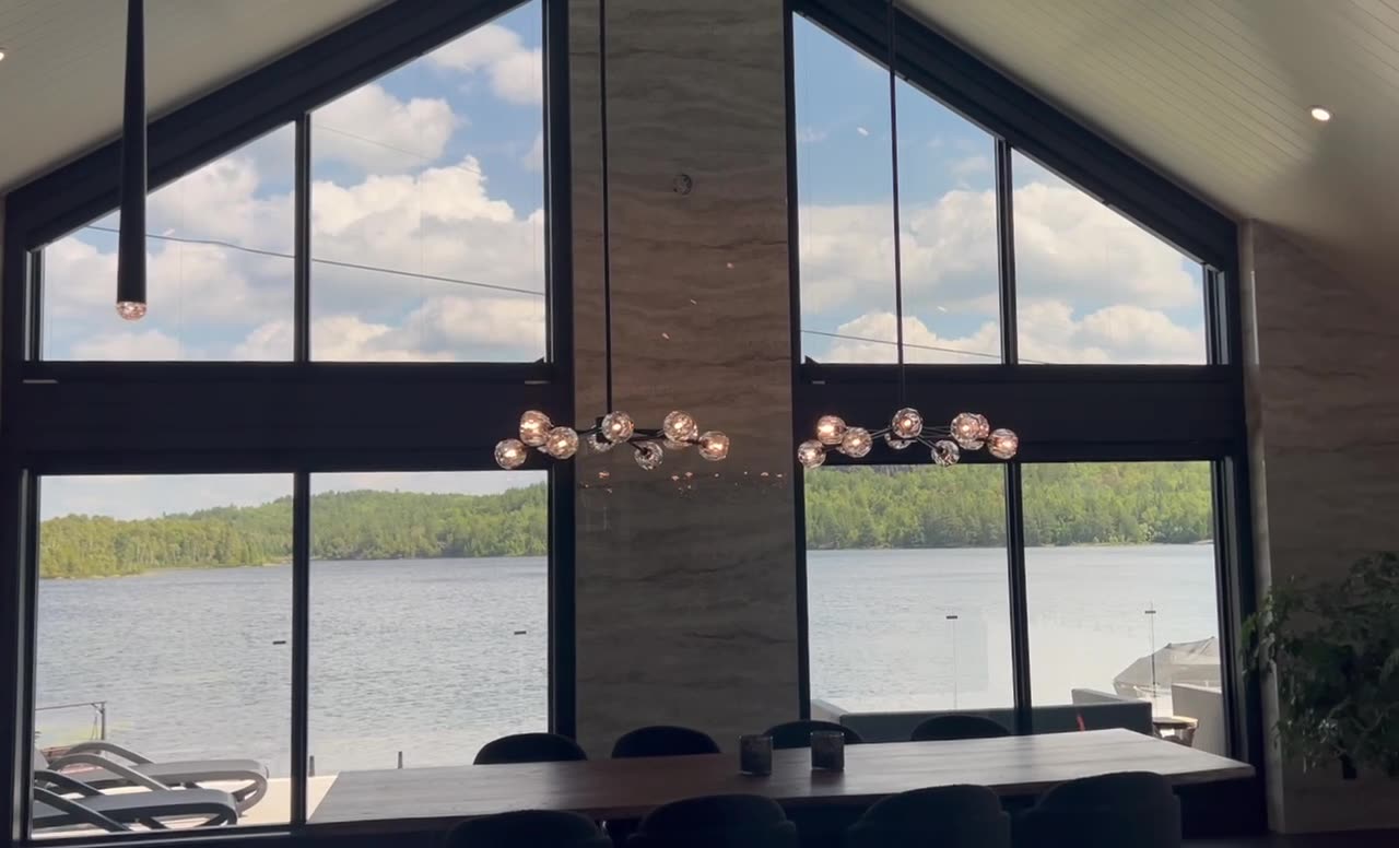 Luxury living room with motorized shades and soft custom drapery